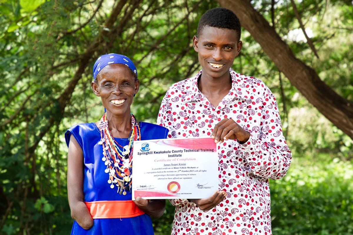 240306 Josh Clay Negosua Tipaai and son James Soipei with certificate in motorbike engineering BLF scholarship